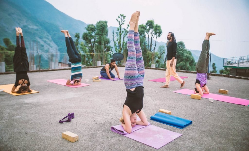 headstand in 500 hour yoga instructor course, dharamshala, himalaya, india