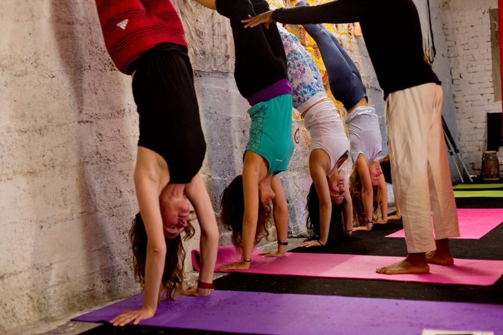 Handstand with wall support shree hari yoga, dharamshala, india