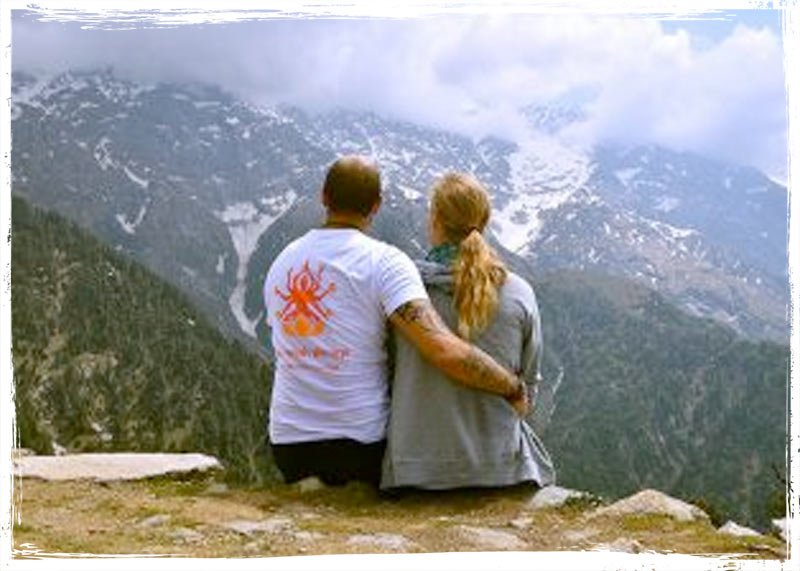 yoga couple in the mountains